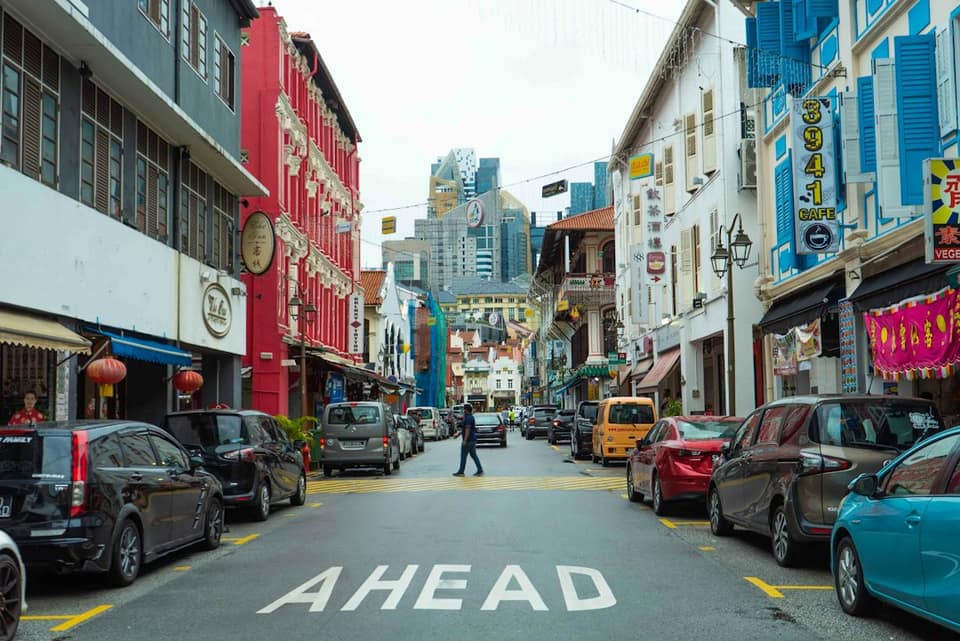 A street with cars parked on both sides of it