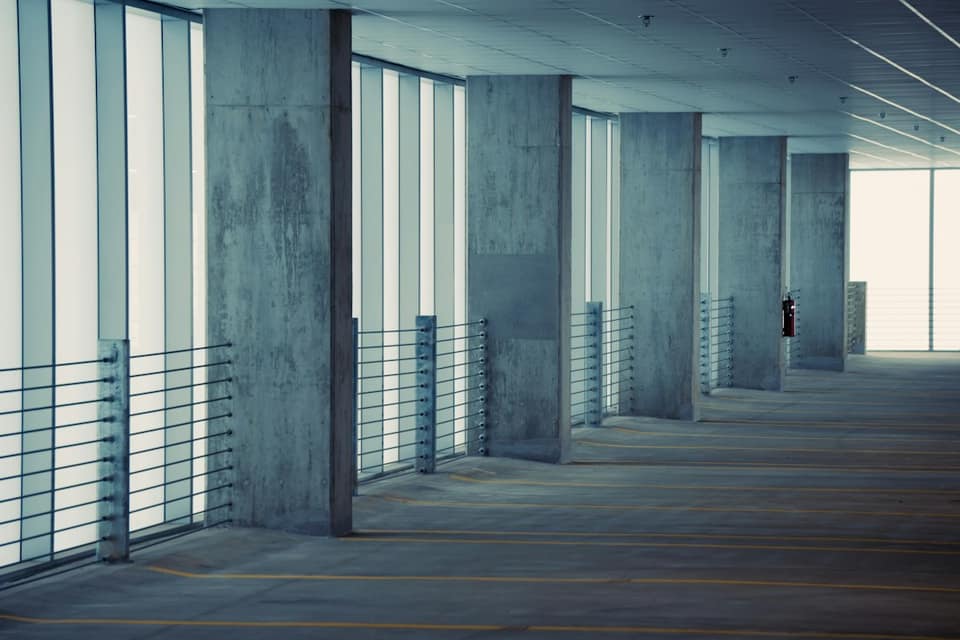 An empty parking garage filled with lots of windows