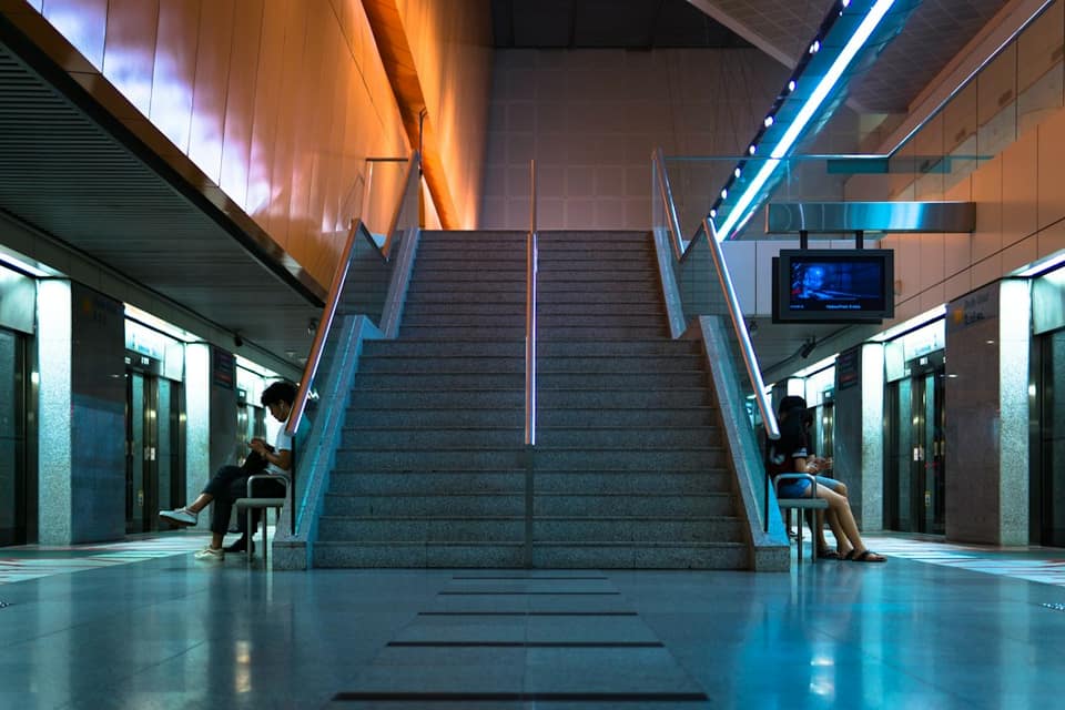 People sitting near stairs